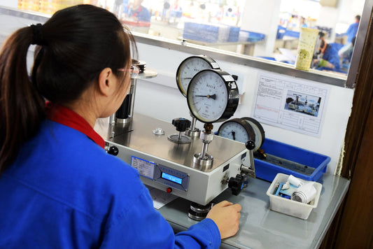 A lady engineer doing calibration for pressure gauge.